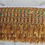 Pasamaneria Gold/multicolor con flecos