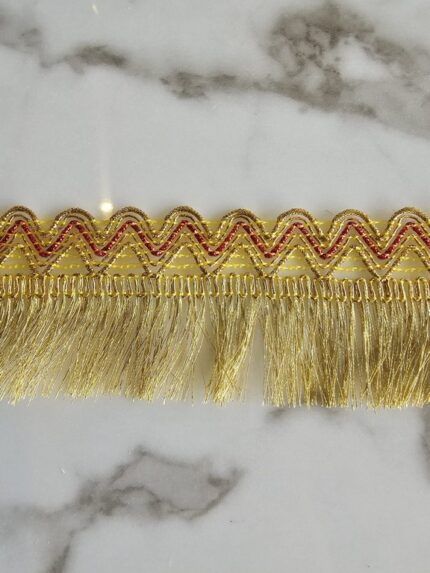 Pasamaneria Gold/fucsia con flecos
