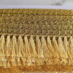 Pasamaneria Gold con flecos