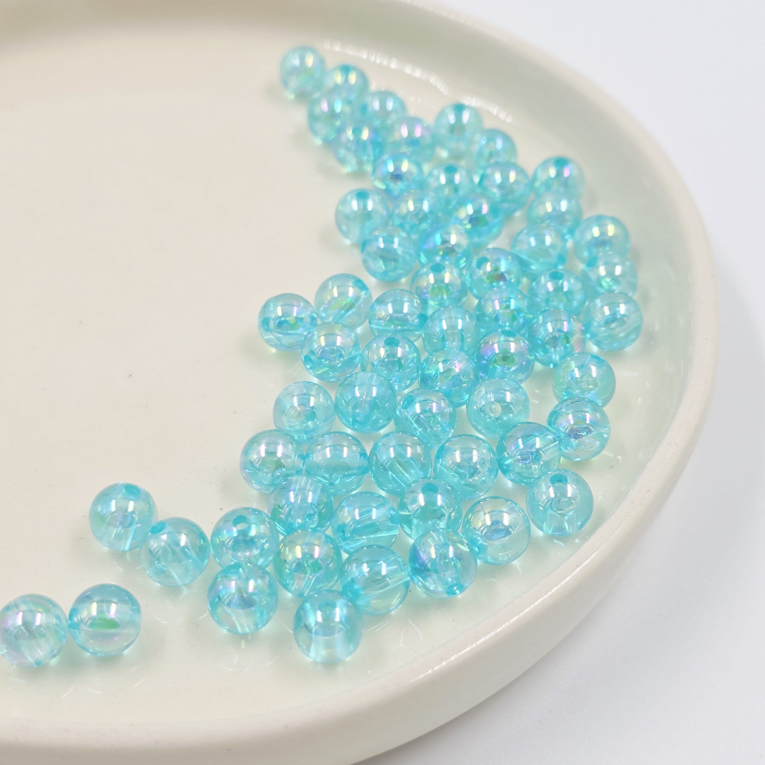 2025/02/1000597096-scaled.jpg BOLSA PERLAS TORNASOL TURQUESA.
8MM X 500 GRS (21-29-2) - Imagen 1