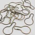 GANCHO PERITA CHICA, BRONCE ANCHO 24*48 MM x 250 UNIDADES.