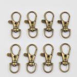 MOSQUETÓN BRONCE 17*36MM X 100 UNIDADES.