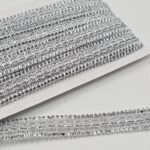 PASAMANERIA PLATEADA 2.5 CM DE ANCHO.
X 10 YARDAS.