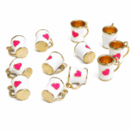 COLGANTE METAL B/GOLD TAZA CORAZON BLANCO x 12 UNIDADES (14X17mm APROX.).