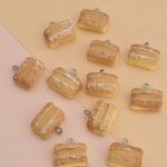 DIJE RESINA X 12 UNIDADES.