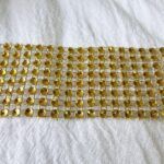 CINTA DE STRASS 8 LINEAS TONO GOLD X 10 YARDAS.