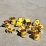 COLGANTE METAL B/GOLD TAZA CORAZON AMARILLO 12 UNIDADES (14X17mm APROX.).