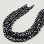 OJO TURCO DE VIDRIO 8 MM NEGRO .
X 1 TIRA.