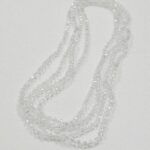 CRISTAL DE ROCA CILINDRO TRANSPARENTE TORNASOL 6MM.
 X 1 TIRA.