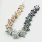 DIJE DE CERAMICA ESTRELLA DE MAR 18*18MM.
X 15 UNIDADES SURTIDAS.
EMA 10-12