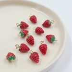 DIJE FRUTILLA DE METAL 18*11MM X 12 UNIDADES (EMC 21-1)