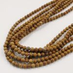 PIEDRA NATURAL JASPE MADERA BOLITA 4MM  X UNA TIRA 38 CM.
(EMC 25-19-1)