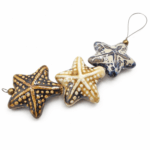 DIJE DE CERAMICA ESTRELLA DE MAR 34MM TIRA x 3 UNIDADES SURTIDAS
(EMA 10-15) - Imagen 2