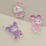 DIJE RESINA 23*24MM X 12 UNIDADES SURTIDO. (EMA 5-3)