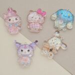 DIJE RESINA CON GLITTER 30*38MM X 12 UNIDADES SURTIDO. (EMA 5-7)