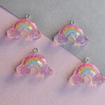 DIJE RESINA ARCO IRIS 27*17MM X 12 UNIDADES SURTIDOS. (EMA 5-17)
