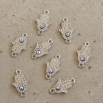 DIJE METAL STRASS MANITO FATIMA OJO TURCO CONECTOR X 12 UNIDADES. (EMA 26-11)