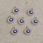 DIJE METAL STRASS OJO TURCO COLGANTE X 12 UNIDADES.(EMA 26-45)