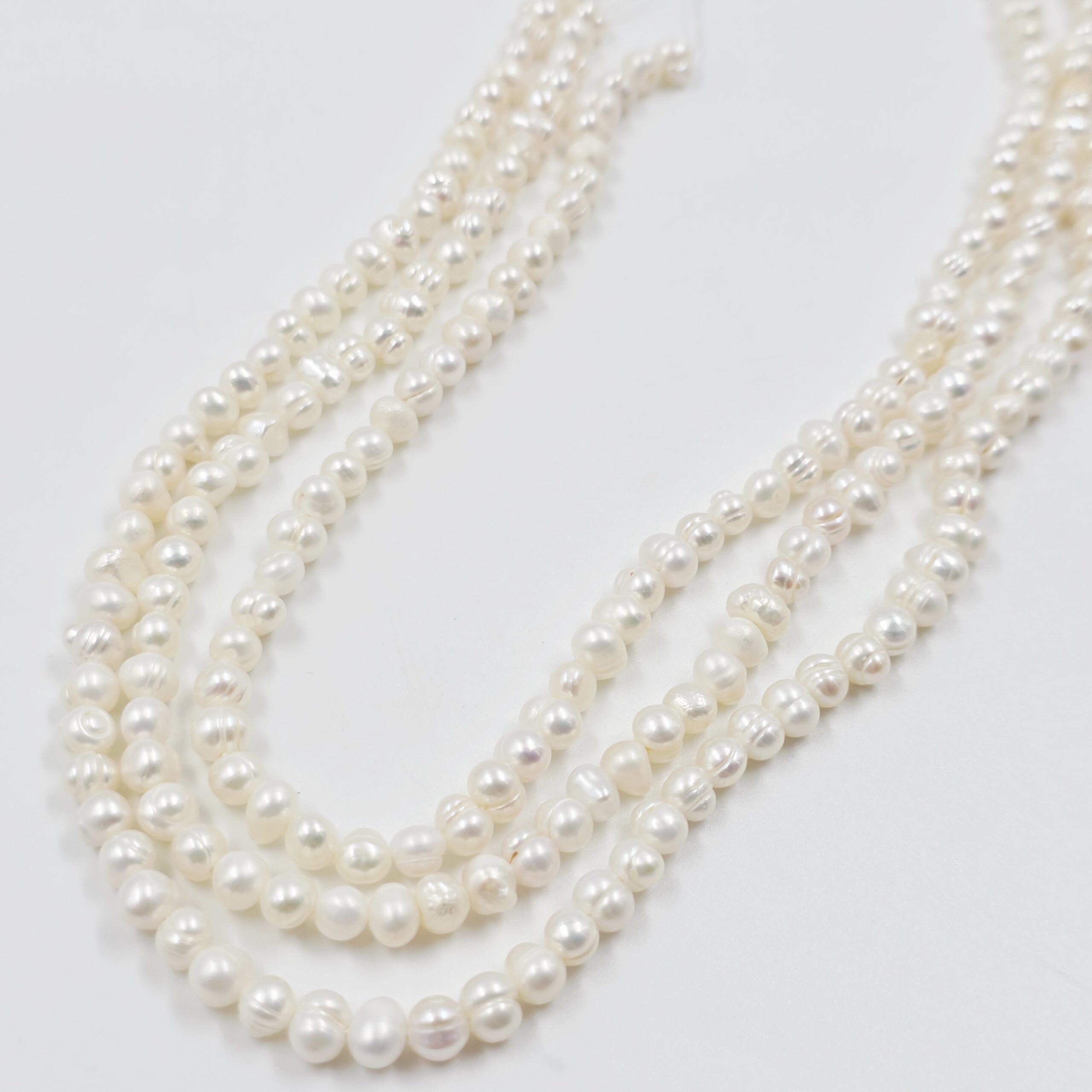 2026/01/1000600204-scaled.jpg TIRA PERLAS DE RIO 5-6MM APROX.(123-3) - Imagen 1