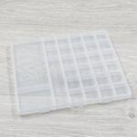 CAJA PLASTICA TRANSPARENTE 23 DIVISIONES 23 x 19 x 1.7 CM (EMC 9-10)