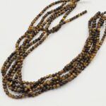 PIEDRA NATURAL OJO DE TIGRE BOLITA 6MM X TIRA 38CM (EMC 25-9-2)